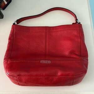 Fun Coach bag in a lovely red shade. Perfect accessory for any event.